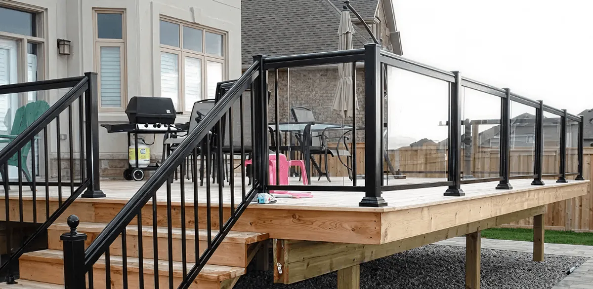 Handrail installation on a deck staircase for safety and code compliance in Erie, PA